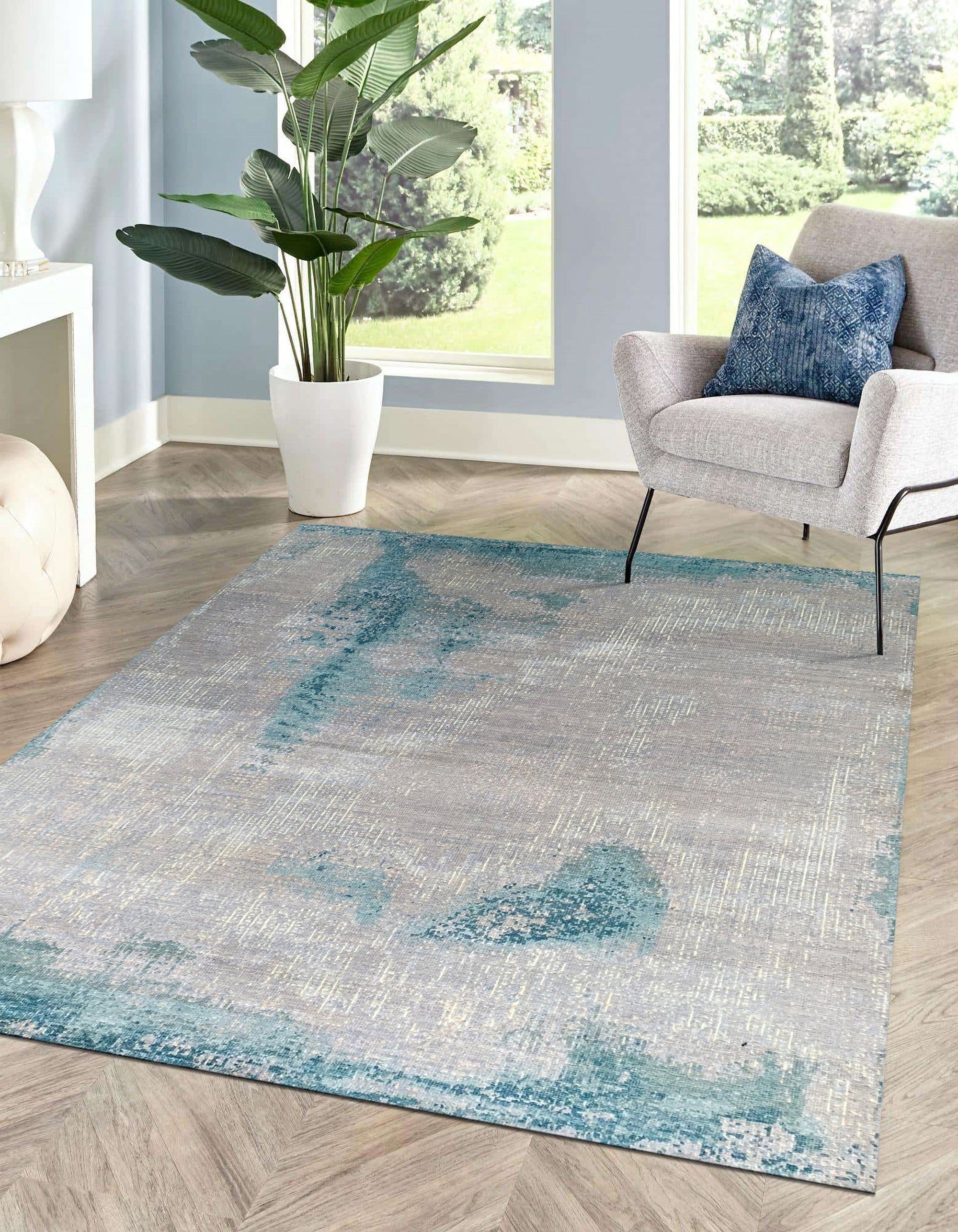 Stylish Sumptuous Aqua Hand Knotted Wool Rug, showcasing its vibrant aqua hues and intricate hand-knotted construction, adding a splash of color and texture to a brightly lit room.