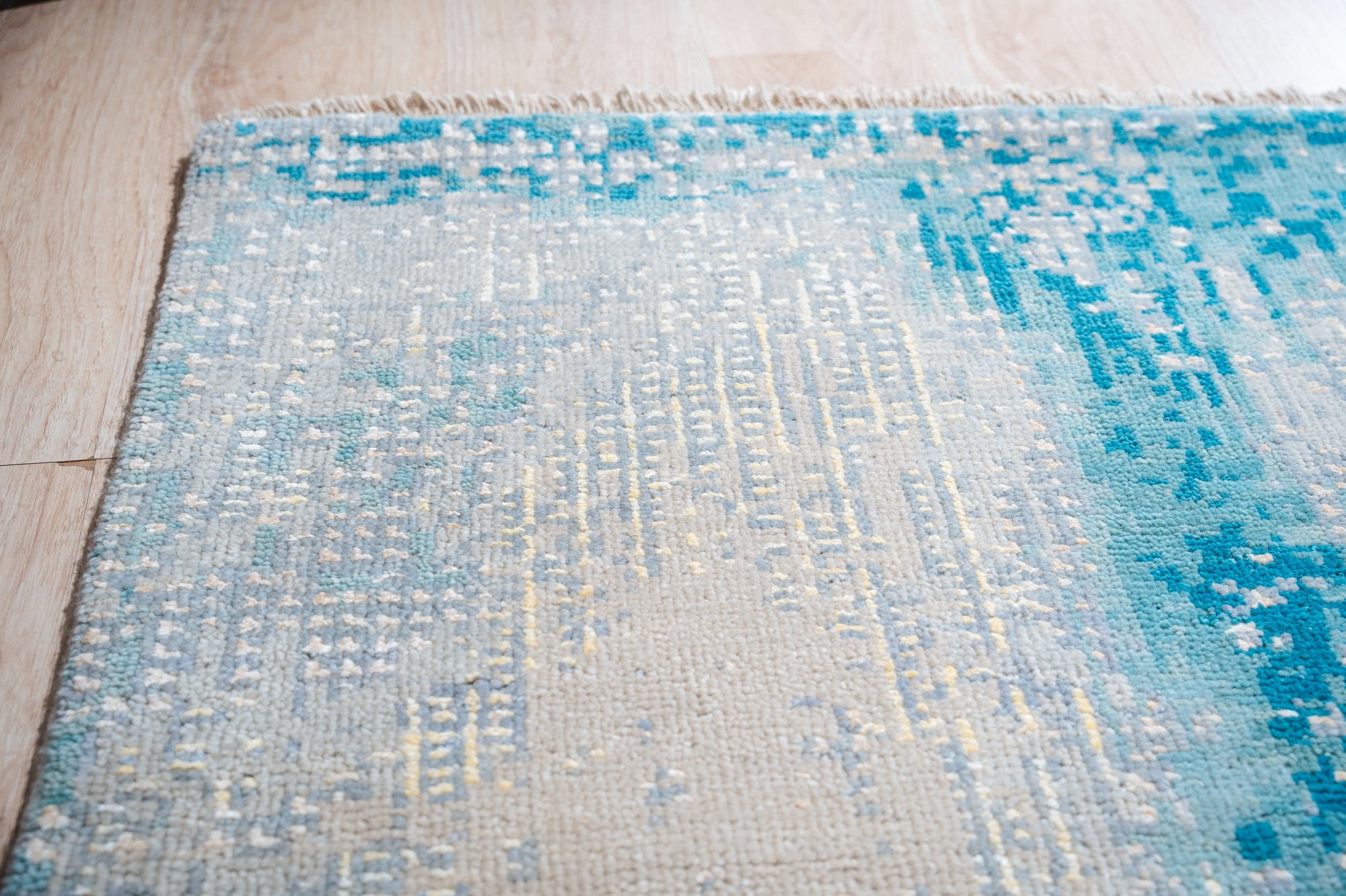 Stylish Sumptuous Aqua Hand Knotted Wool Rug, its cool aqua hues and intricate hand-knotted texture adding a touch of elegance and comfort to a modern living space.