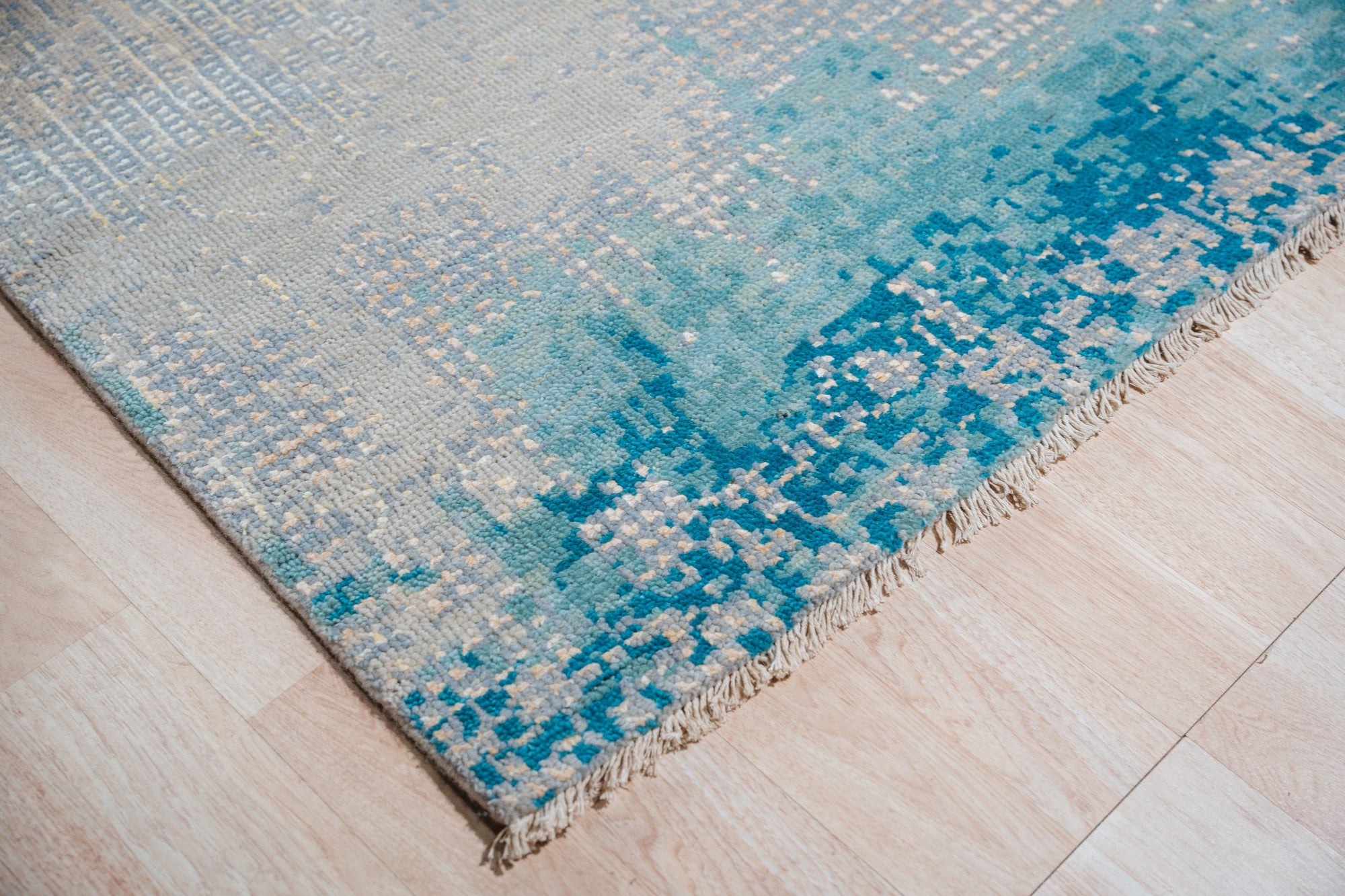 Stylish Sumptuous Aqua Hand Knotted Wool Rug, its tranquil aqua hues and intricate hand-knotted design lending a touch of refined elegance to the room&#39;s decor.