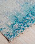 Stylish Sumptuous Aqua Hand Knotted Wool Rug, its tranquil aqua hues and intricate hand-knotted design lending a touch of refined elegance to the room's decor.