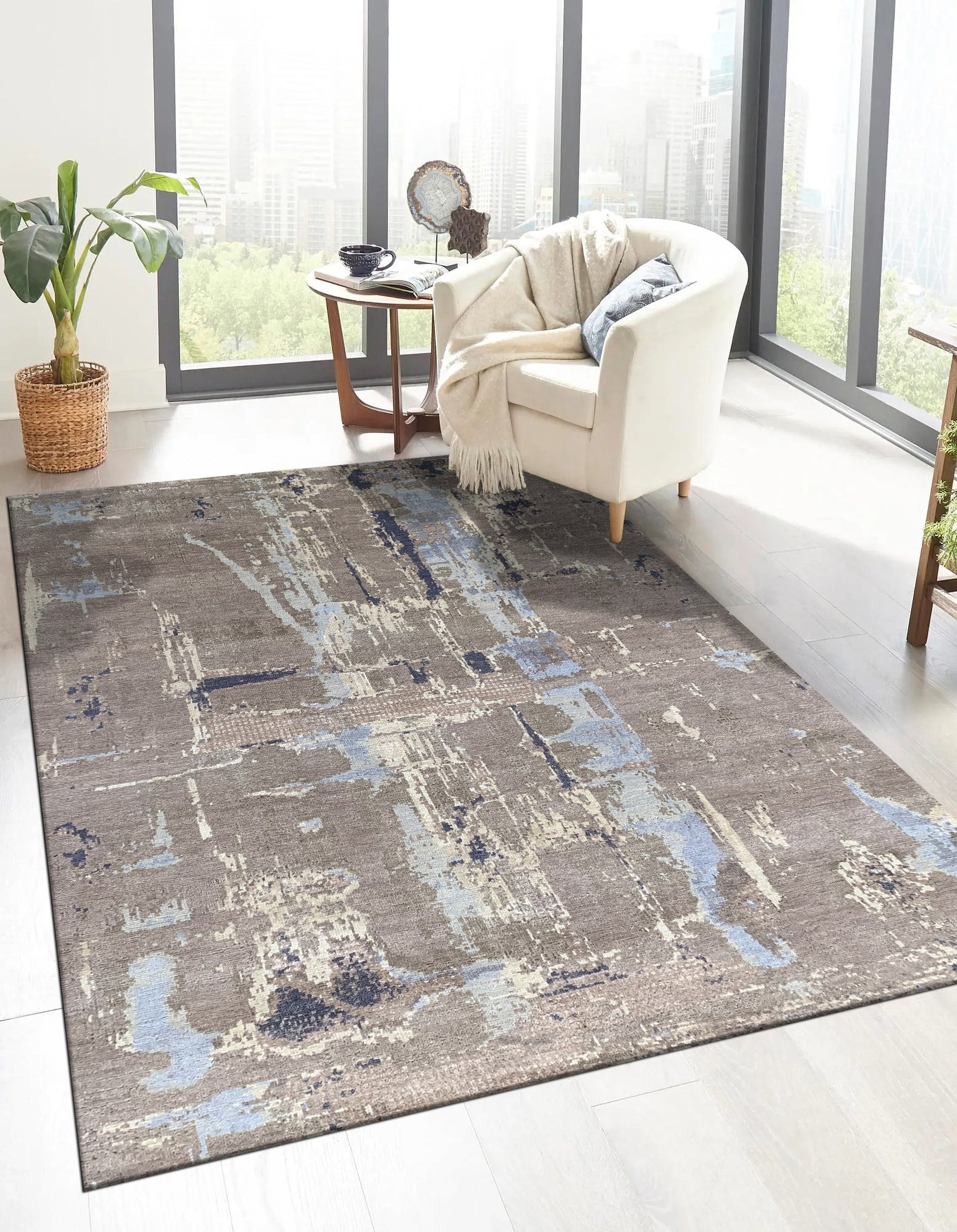 Clara Stylish Gray Hand Knotted Wool Rug, showcasing its subtle, hand-knotted texture and sophisticated gray tones in a stylish interior setting.