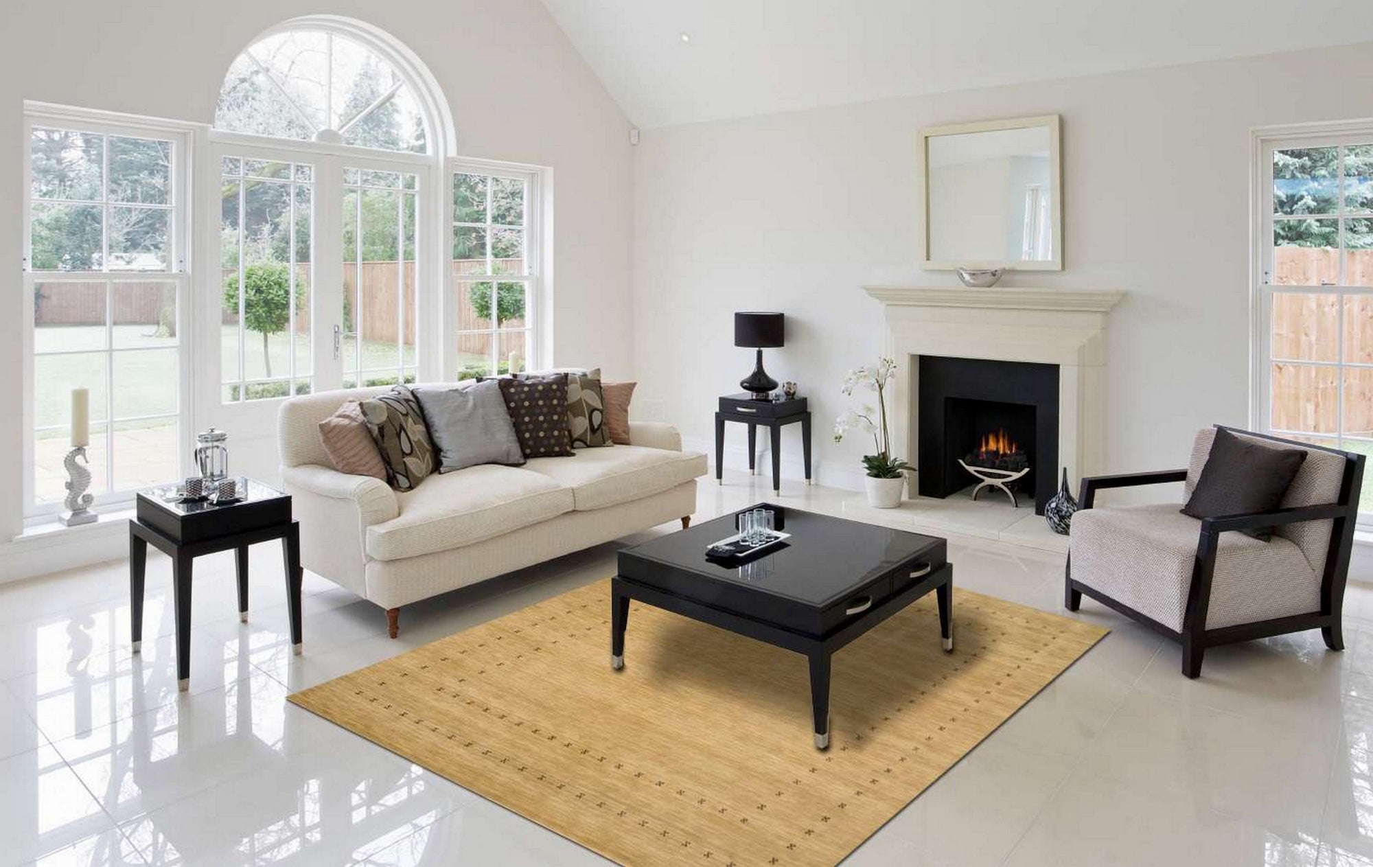 Jasmine Alluring Beige Handmade Wool Rug gracing a warmly lit living room. Soft beige tones and intricate wool texture complement the minimalist furniture and decor, creating a serene and inviting space.