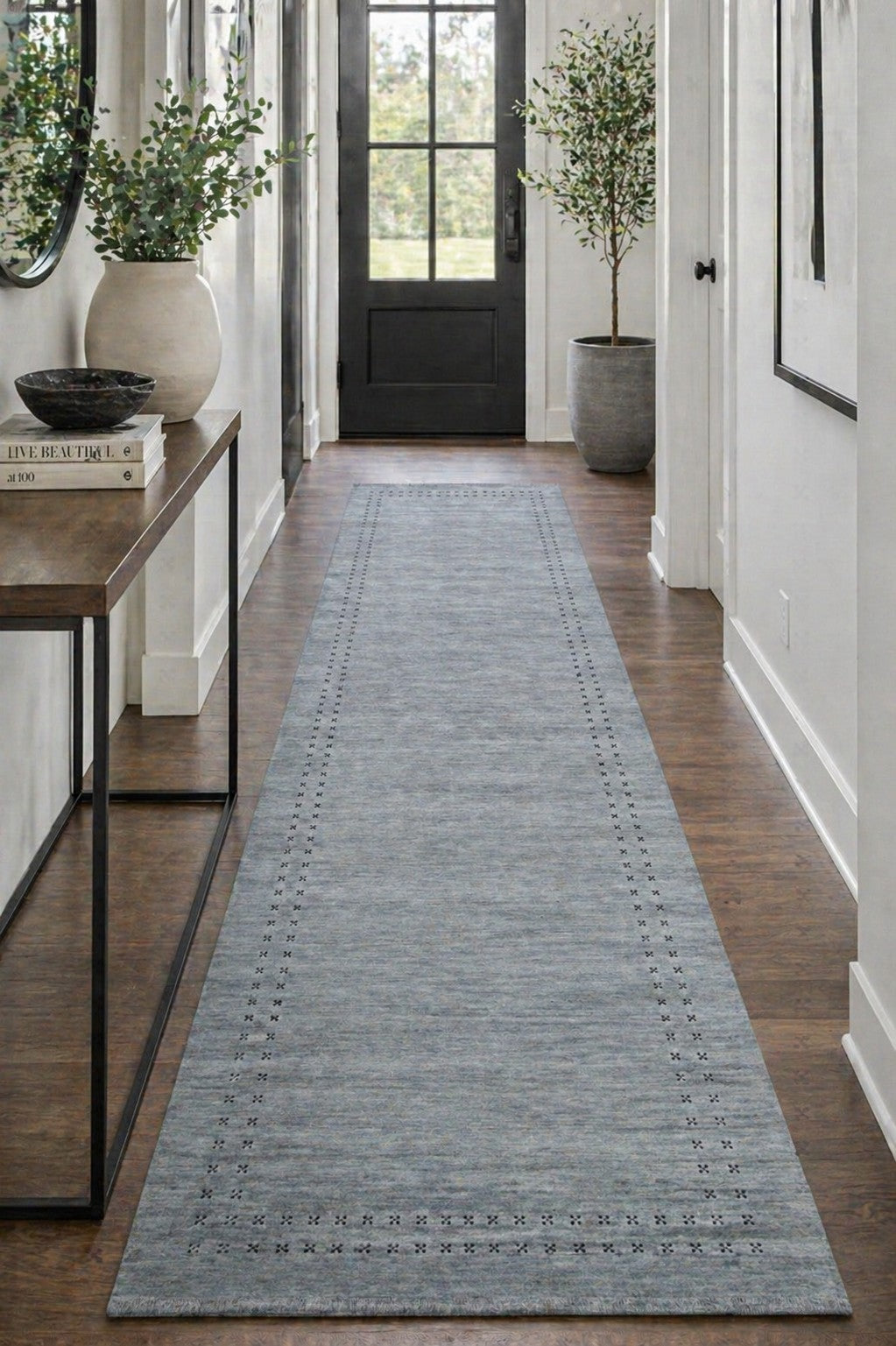 Jasmine Alluring Gray Handmade Wool Rug styled in a modern living room - area rug lifestyle photo