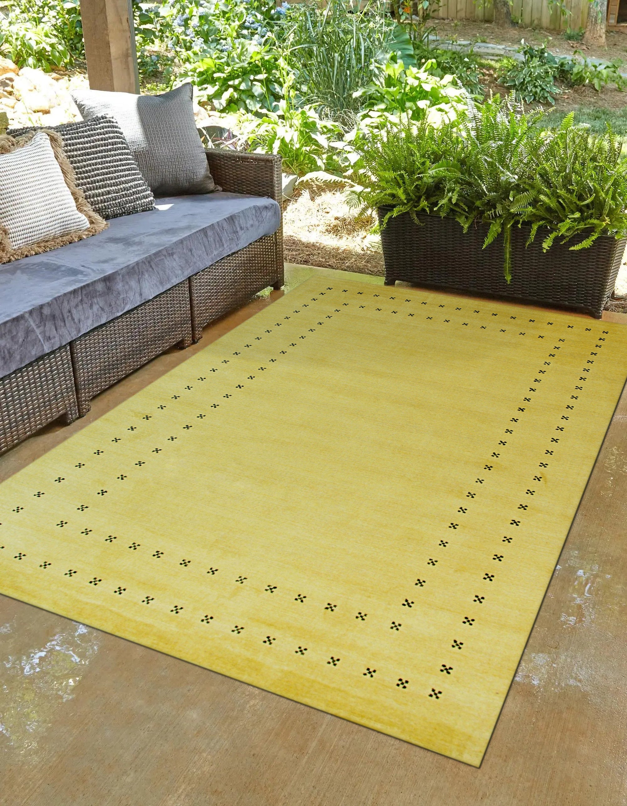 Jasmine Alluring Yellow Handmade Wool Rug, a vibrant yellow wool rug with a subtle geometric pattern, styled in a bright living room setting with natural light.