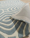 Rhea Stylish Blue Hand Tufted Wool Rug, plush and vibrant blue tones dance across its hand-tufted wool surface, lending a touch of modern elegance to the space.