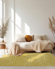 Ruby Trara Yellow Hand Tufted Wool Rug displayed in a brightly lit living room setting. Textured pile of the yellow wool rug is prominent, hinting at its soft feel.