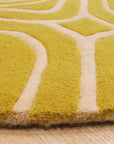 Ruby Trara Yellow Hand Tufted Wool Rug, showcasing a vibrant yellow hue and intricate hand-tufted details, displayed in a lifestyle setting.