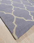 Celia Moroccan Light Purple Hand Tufted Wool Rug, a light purple wool rug with a Moroccan-inspired design, seen in a bright, airy living room.