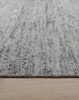 Refined Exquisite Gray Hand Knotted Silk Rug, its subtle gray hues and intricate hand-knotted construction displayed in a detailed close-up, showcasing the rug's luxurious texture.