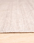 Maya Unique Beige Handmade Wool & Viscose Rug, its soft beige tones and subtle sheen adding warmth to a modern living space, showcasing the blend of wool and viscose fibers.