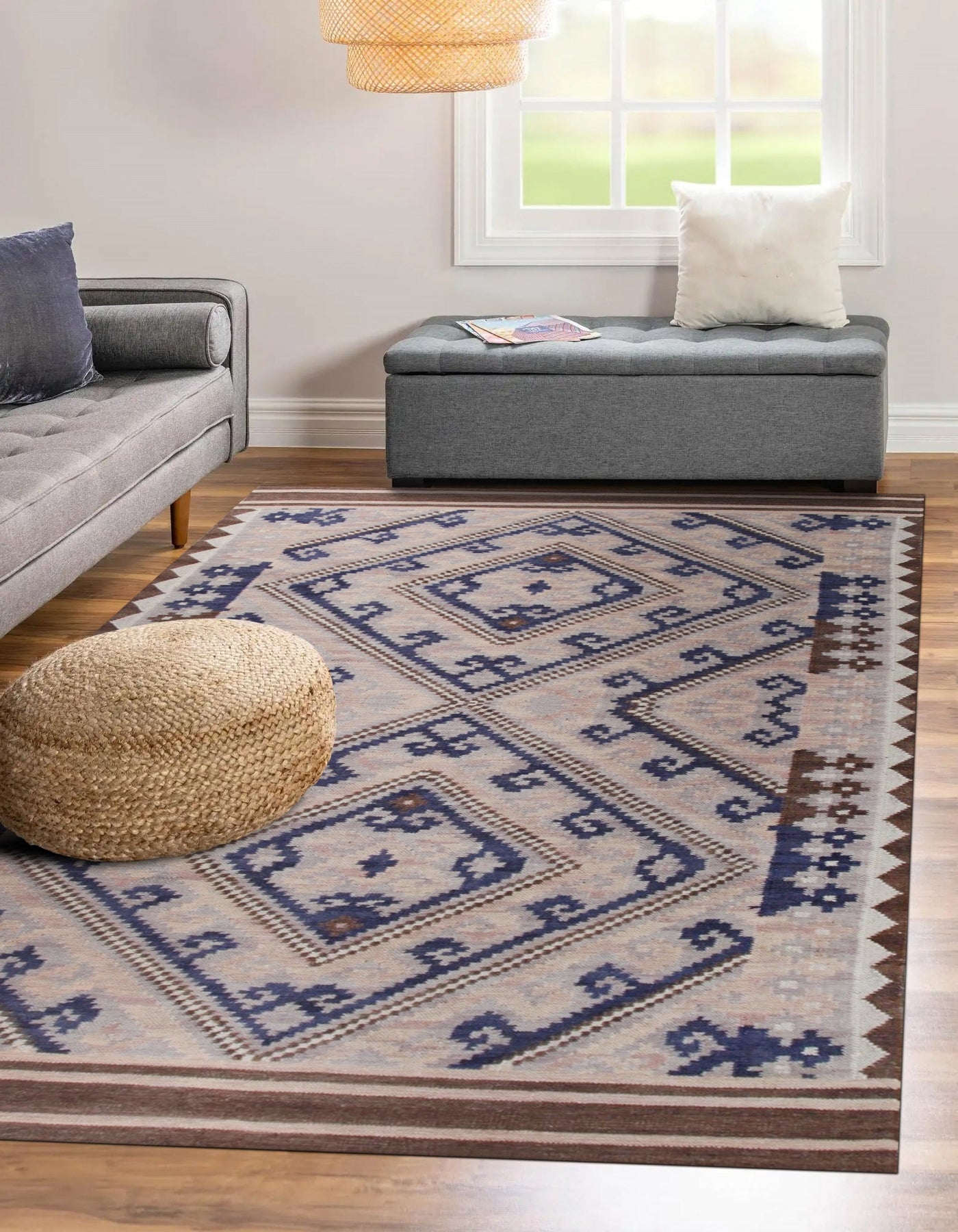 Penelope Jade Brown Flatweave Wool Rug, a brown and jade wool rug with a subtle, organic pattern, showcased in a bright living room setting with neutral furniture and natural light.