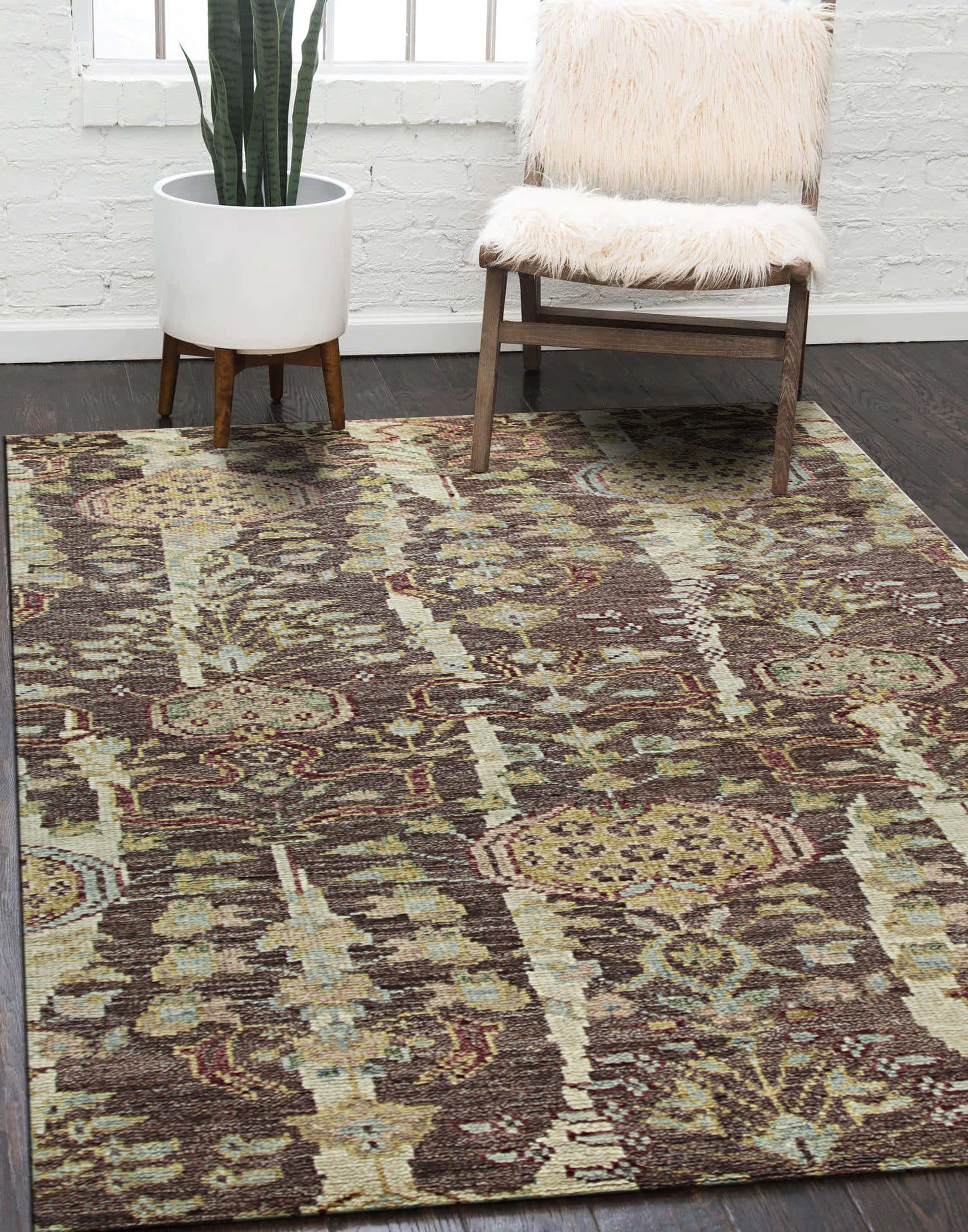 Iris Sophisticated Brown Hand Knotted Wool Rug, showcasing intricate patterns and warm brown tones, softening a well-lit living space with hardwood floors.