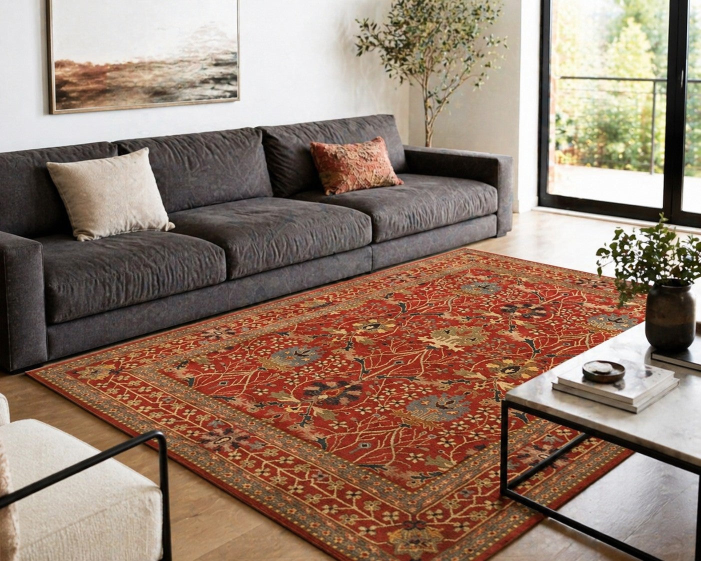 Lydia Vibrant Red Hand Tufted Wool Rug styled in a modern living room with charcoal sofa - area rug lifestyle photo