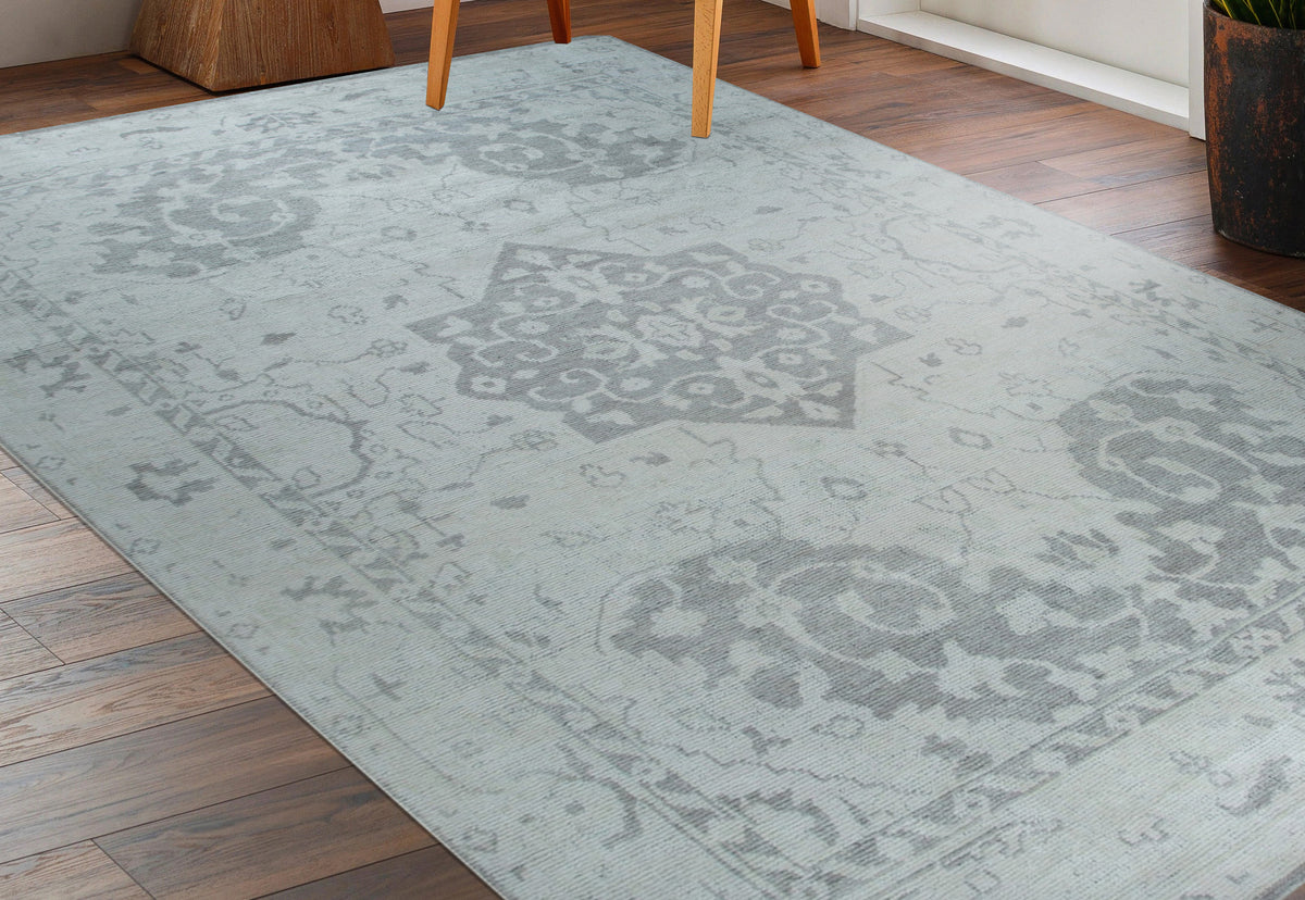 Silver Oasis Rug shown in a styled living room setting