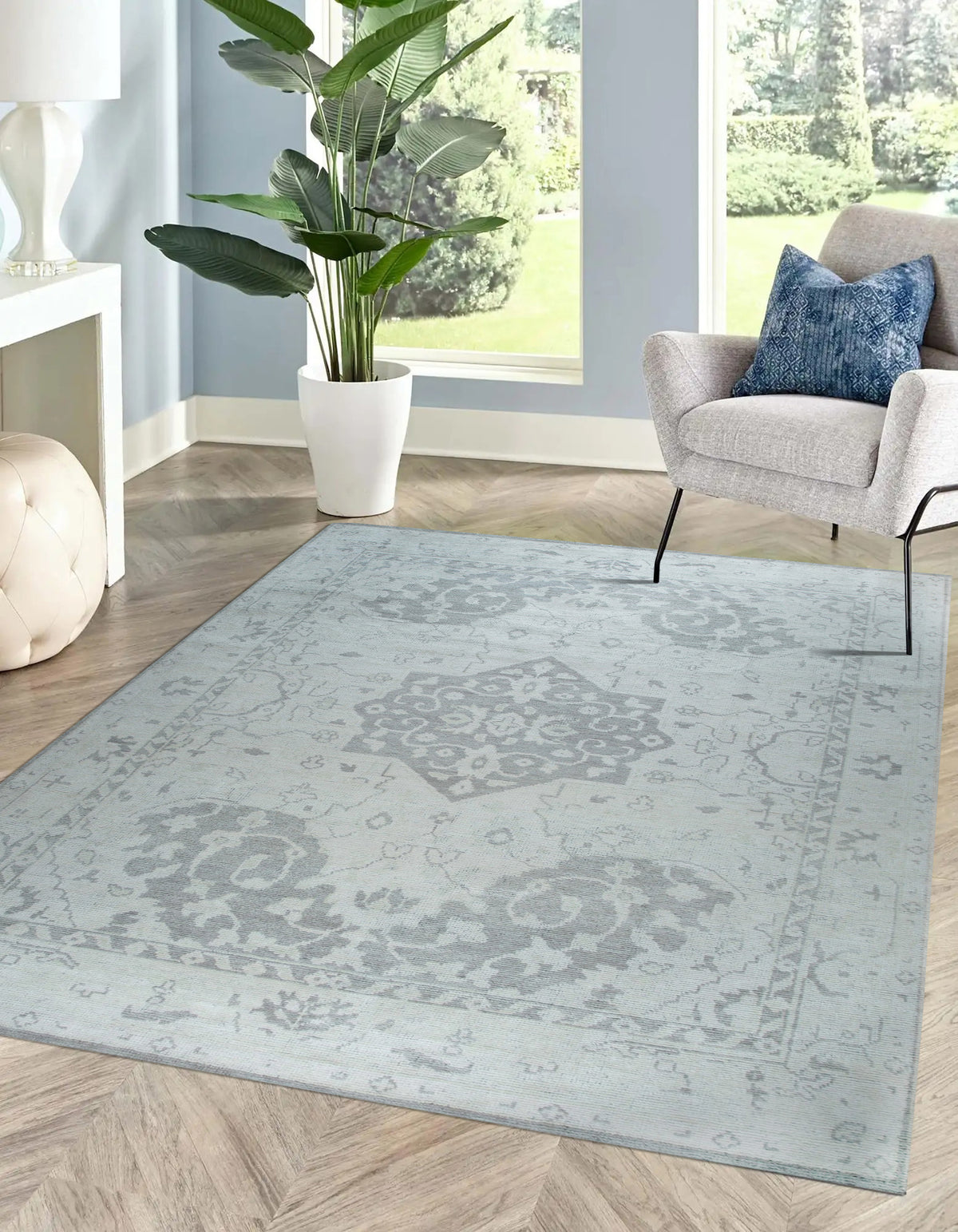 Silver Oasis Rug shown in a styled living room setting