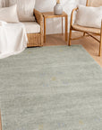 Freya Gabbeh Gray Handmade Wool Rug shown in a styled living room setting