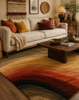 Sloane Multicolor Hand Tufted Wool area rug styled in a warm bohemian living room with cream linen sofa and rust mustard accent pillows - lifestyle photo