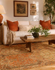 Ophelia Bianca Orange Hand Tufted Wool Rug styled in a warm eclectic living room - area rug lifestyle photo