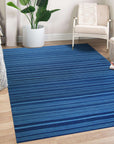 Para Penelope Blue Flatweave Wool Rug, calming blues and intricate geometric patterns define this flatweave wool rug, adding a touch of bohemian elegance to a sun-drenched living space.