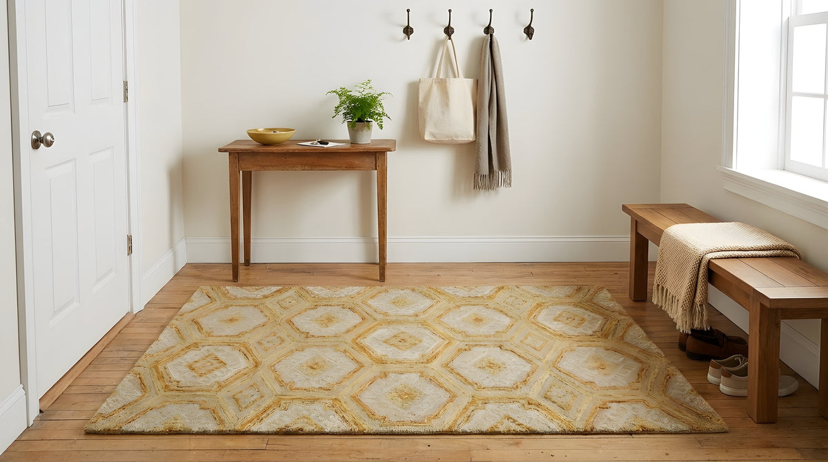 Alluring Laine Gold Hand Tufted Wool Rug in a entryway