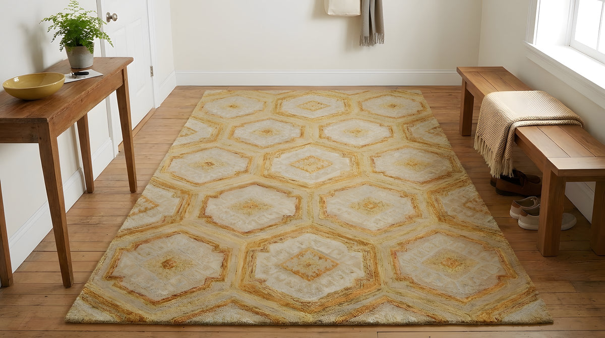 Alluring Laine Gold Hand Tufted Wool Rug in a entryway