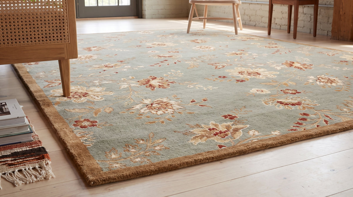 Amara Elegant Gray and Gold Machine Made Wool Rug in a sunroom