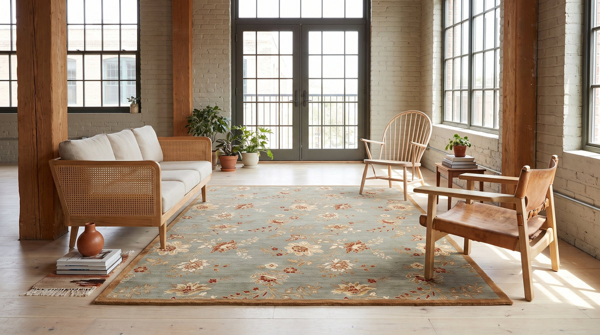 Amara Elegant Gray and Gold Machine Made Wool Rug in a sunroom