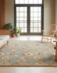 Amara Elegant Gray and Gold Machine Made Wool Rug in a sunroom