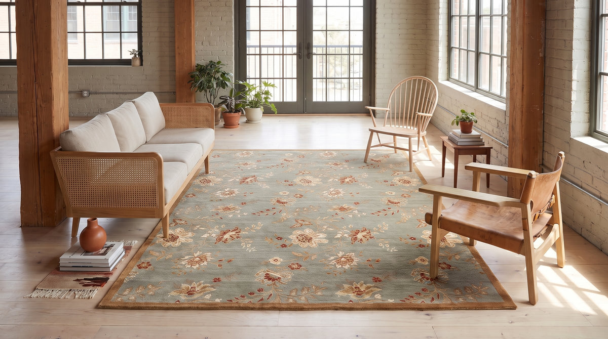 Amara Elegant Gray and Gold Machine Made Wool Rug in a sunroom