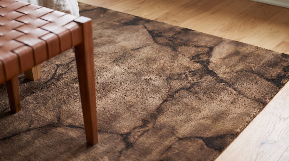 Artistic Brown Hand Knotted Wool Rug in a bedroom
