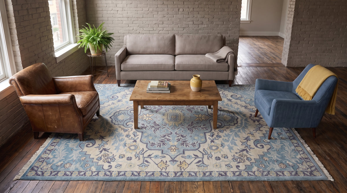 Bianca Oriental Ivory and Blue Hand Knotted Wool Rug in a living room