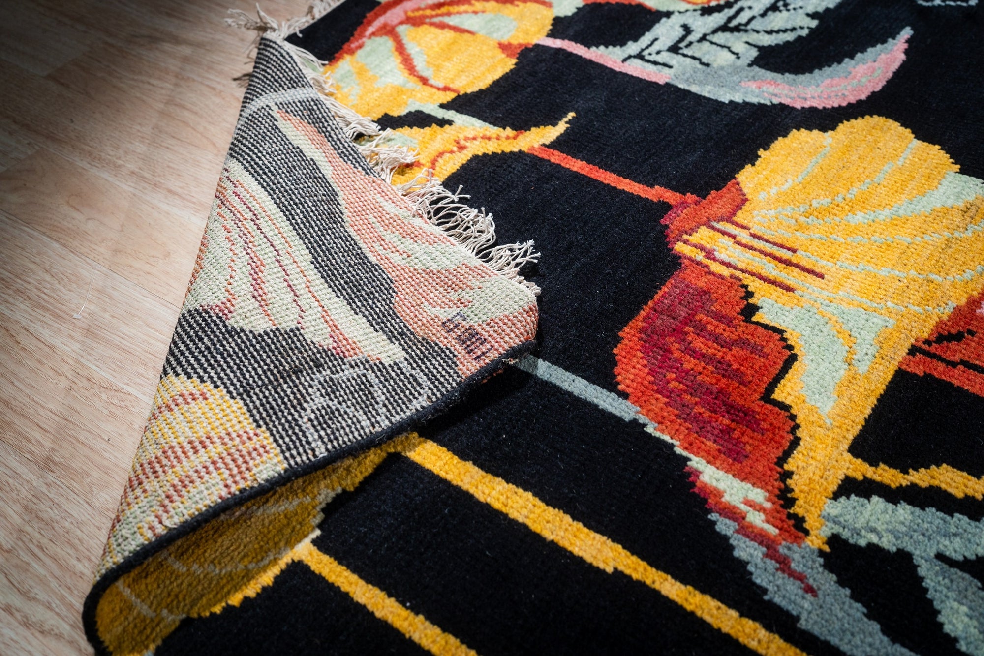 Black floral contemporary rug back corner detail