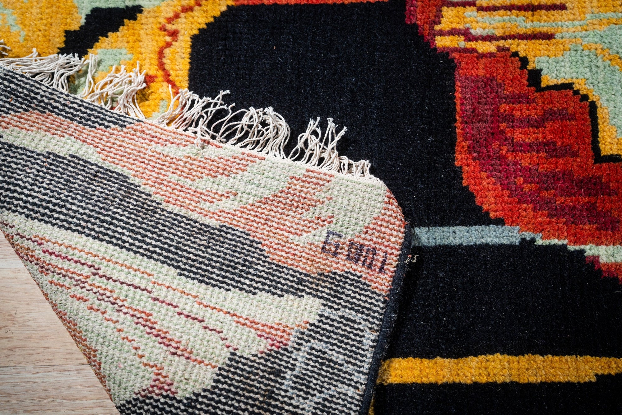 Black floral contemporary rug hand-knotted back detail