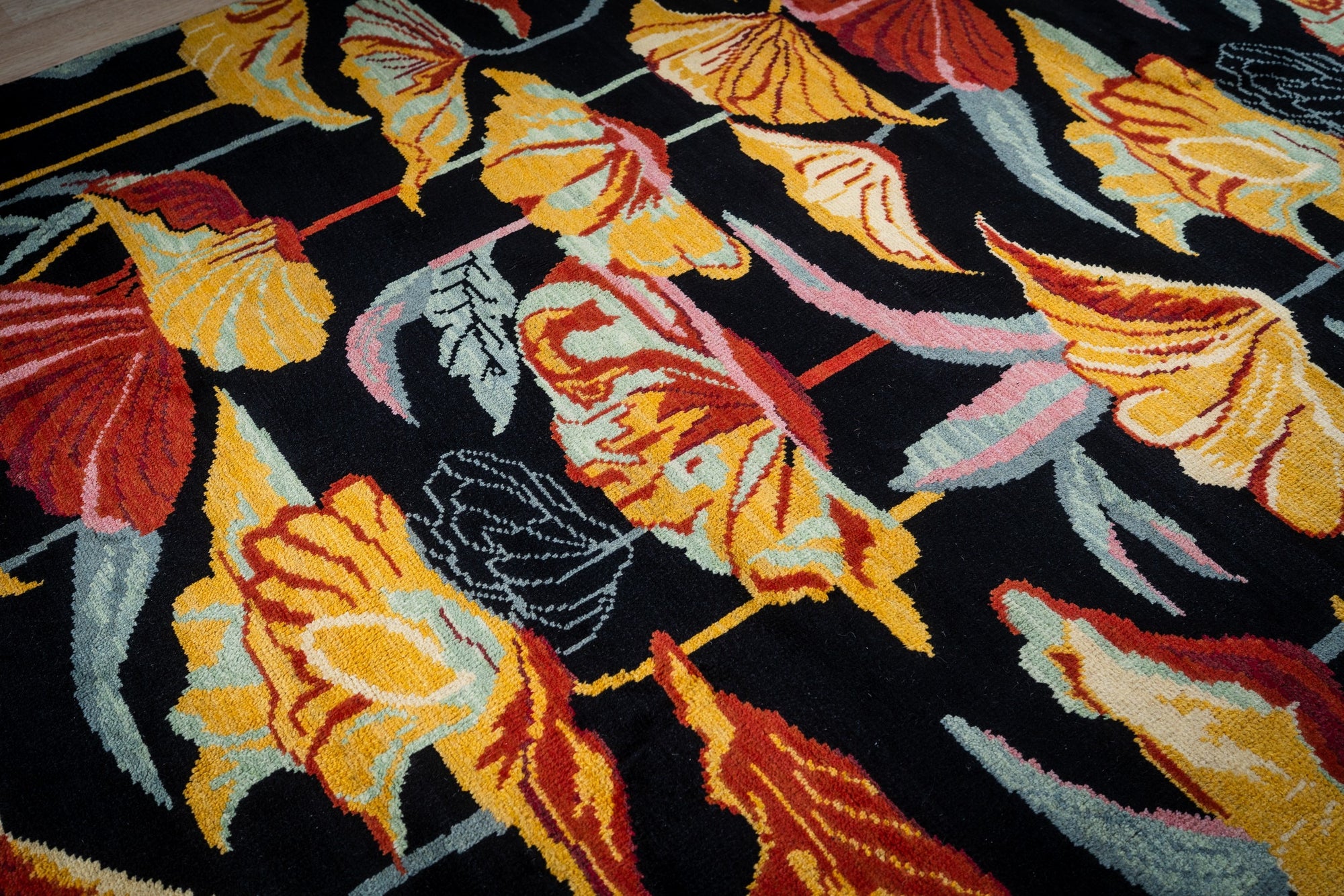 Black floral contemporary rug angled field detail