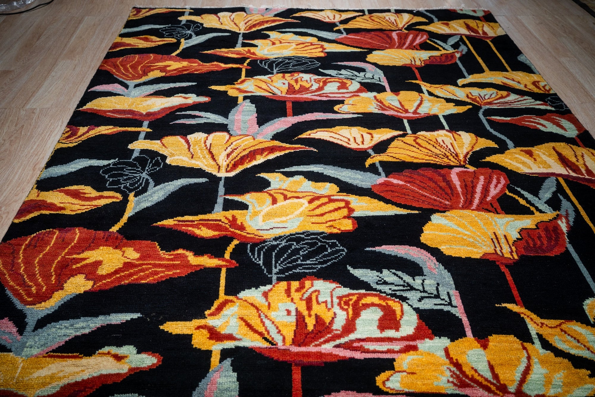 Black floral contemporary rug field detail with bold blossoms
