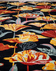 Black floral contemporary rug field detail with bold blossoms