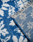 Blue ivory Oushak rug back corner detail