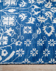 Blue ivory Oushak rug corner and fringe detail