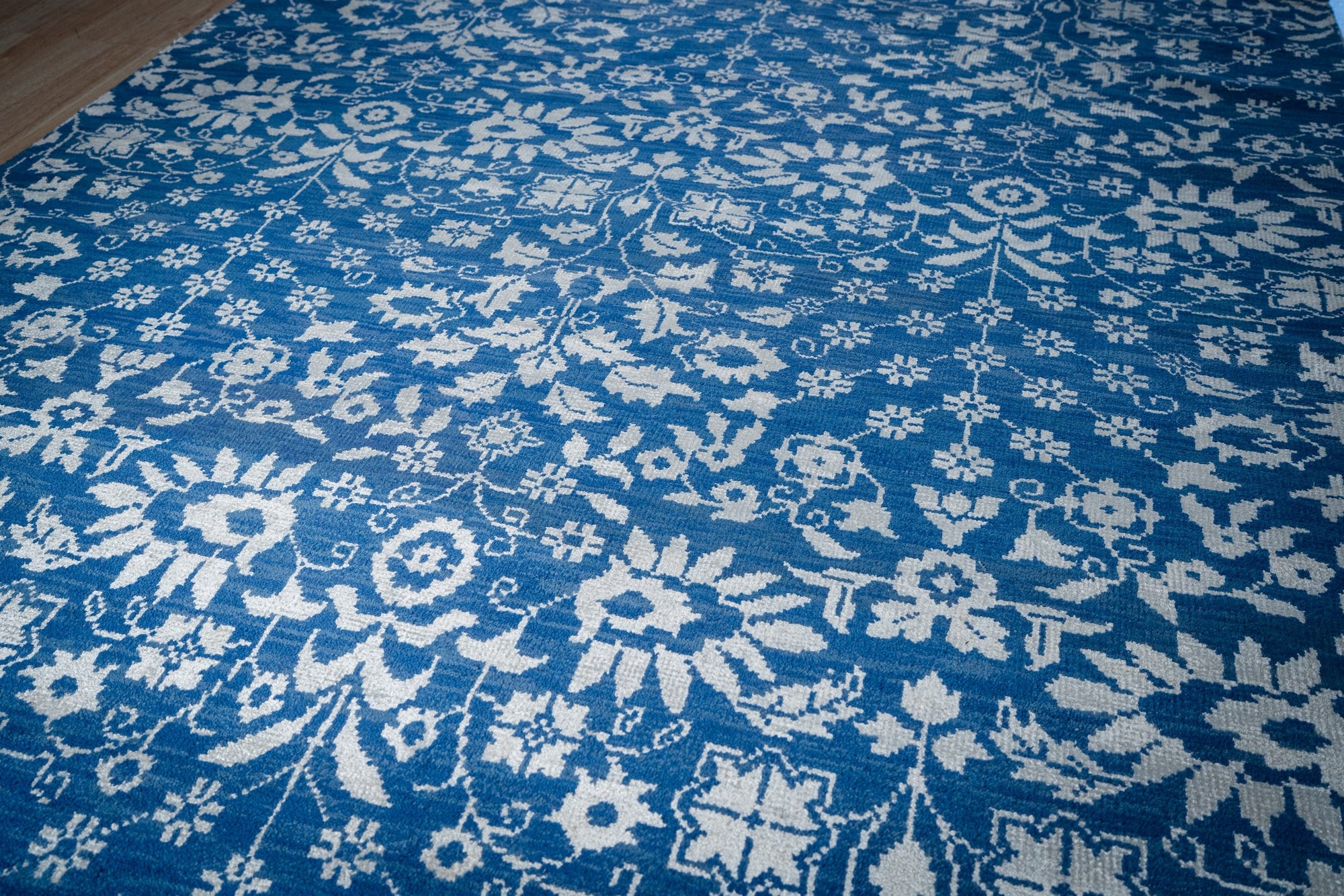 Blue ivory Oushak rug angled field detail