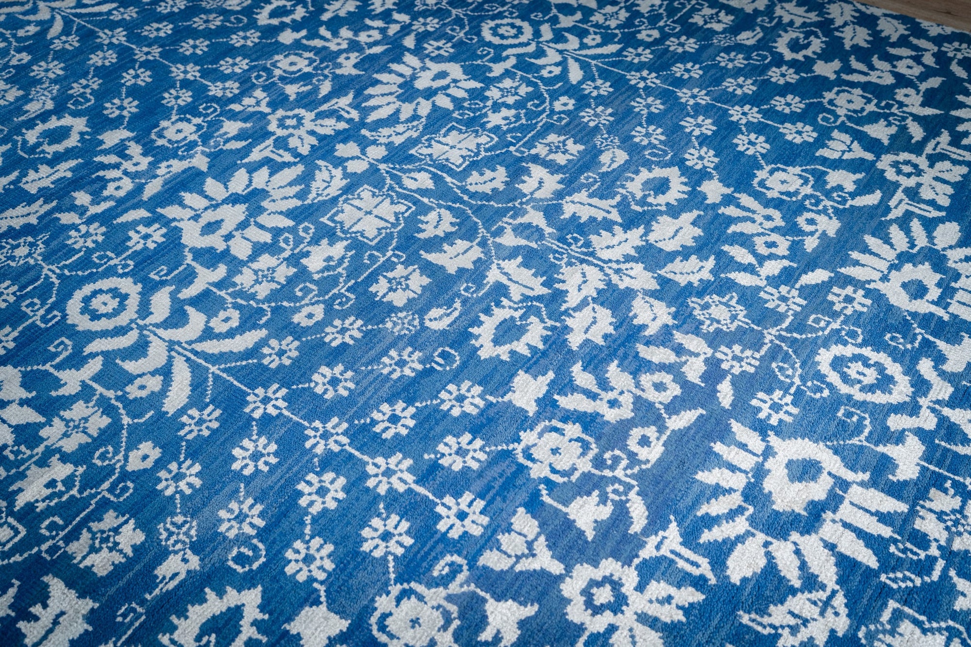 Blue ivory Oushak rug top-down allover floral detail