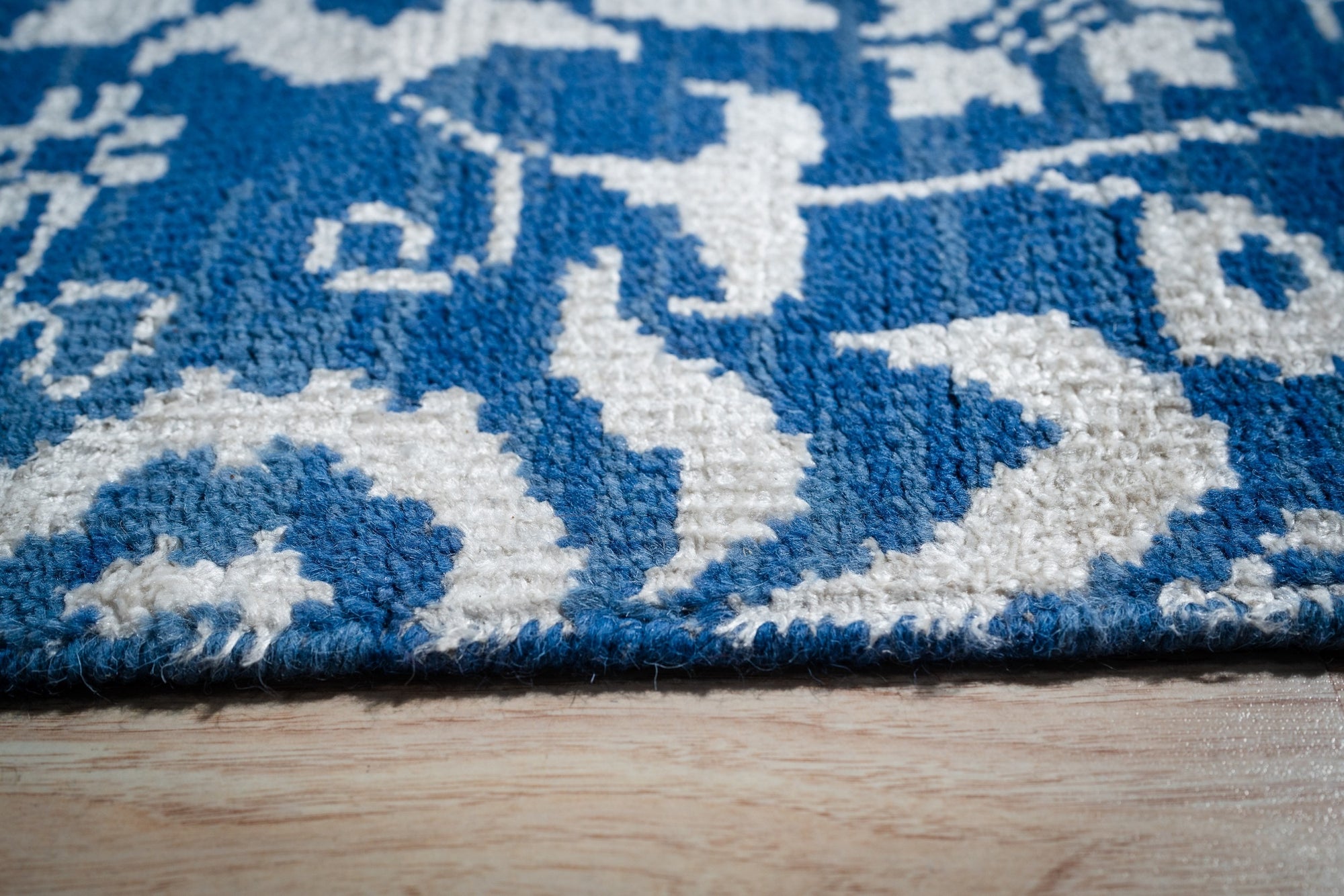 Blue ivory Oushak rug floral motif close-up