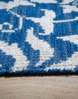 Blue ivory Oushak rug floral motif close-up