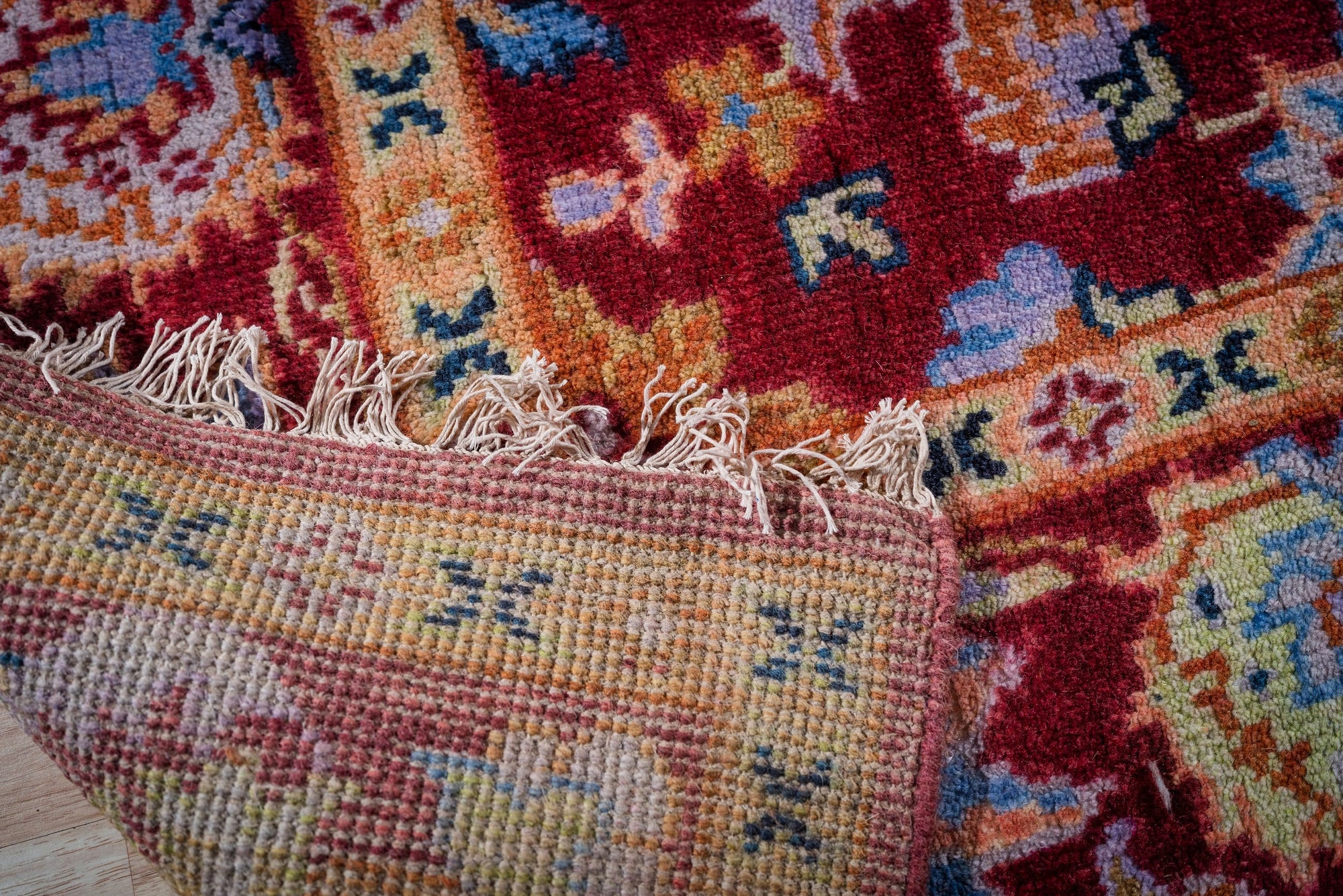 Burgundy Oushak rug hand-knotted back and fringe detail