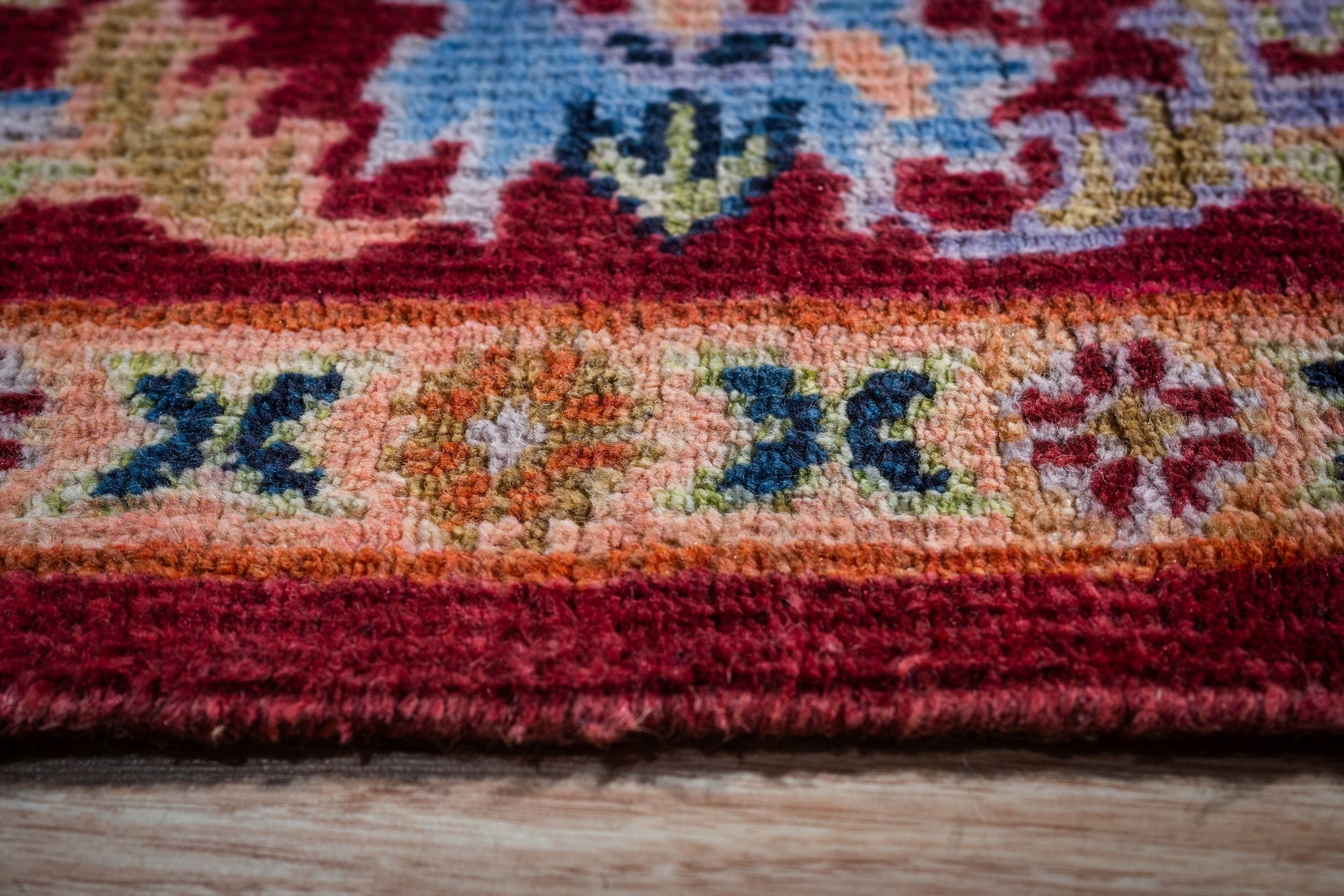 Burgundy Oushak rug border close-up