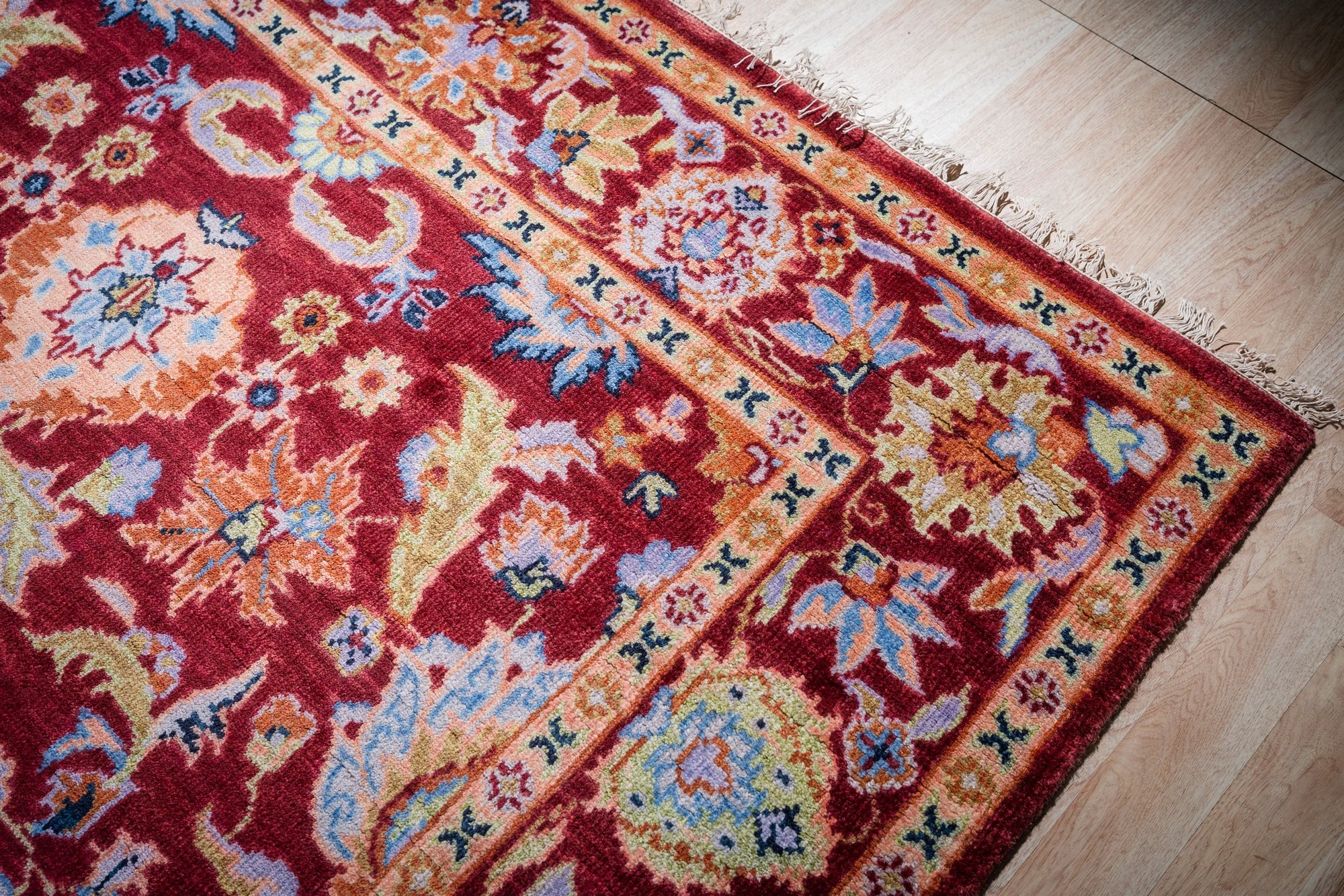 Burgundy Oushak rug corner and border detail