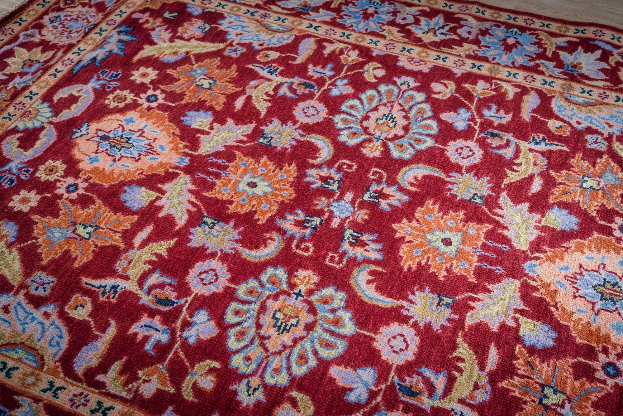 Burgundy Oushak rug angled field detail
