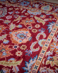 Burgundy Oushak rug field and border detail