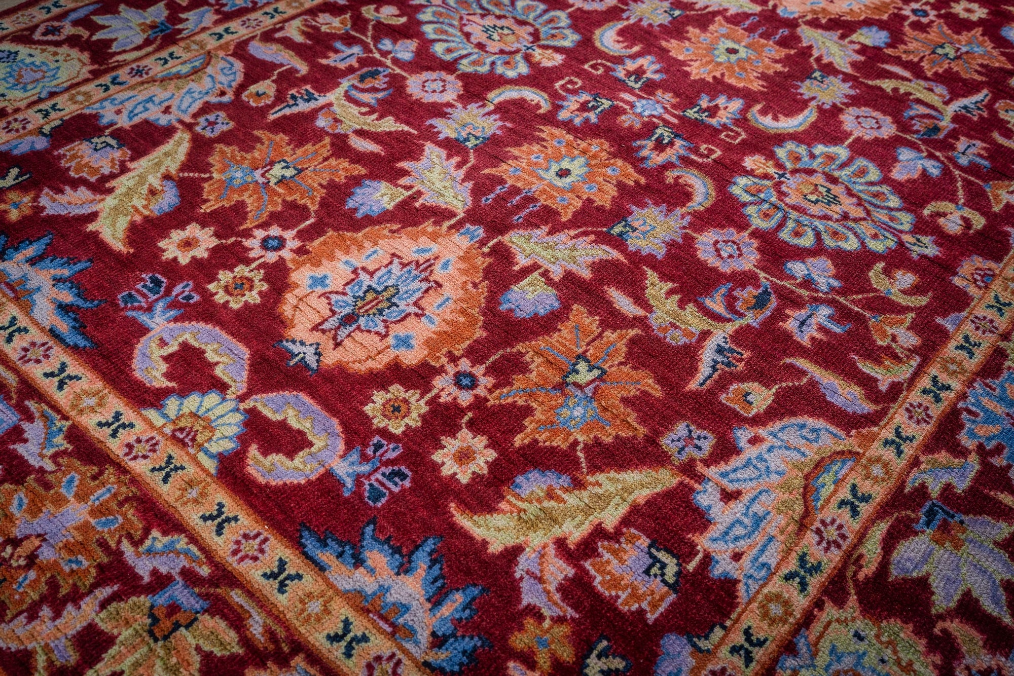 Burgundy Oushak rug field detail with floral palmettes