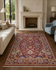Burgundy Oushak floral rug styled in a living room with fireplace