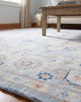 Captivating Timeless Light Blue Hand Knotted Wool Rug in a living room